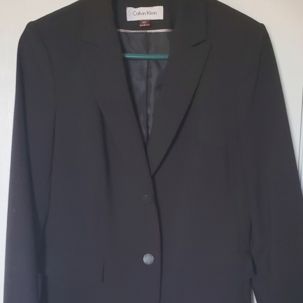 Calvin Klein 2 piece lined suit. Black. Single breast jacket and pencil skirt.